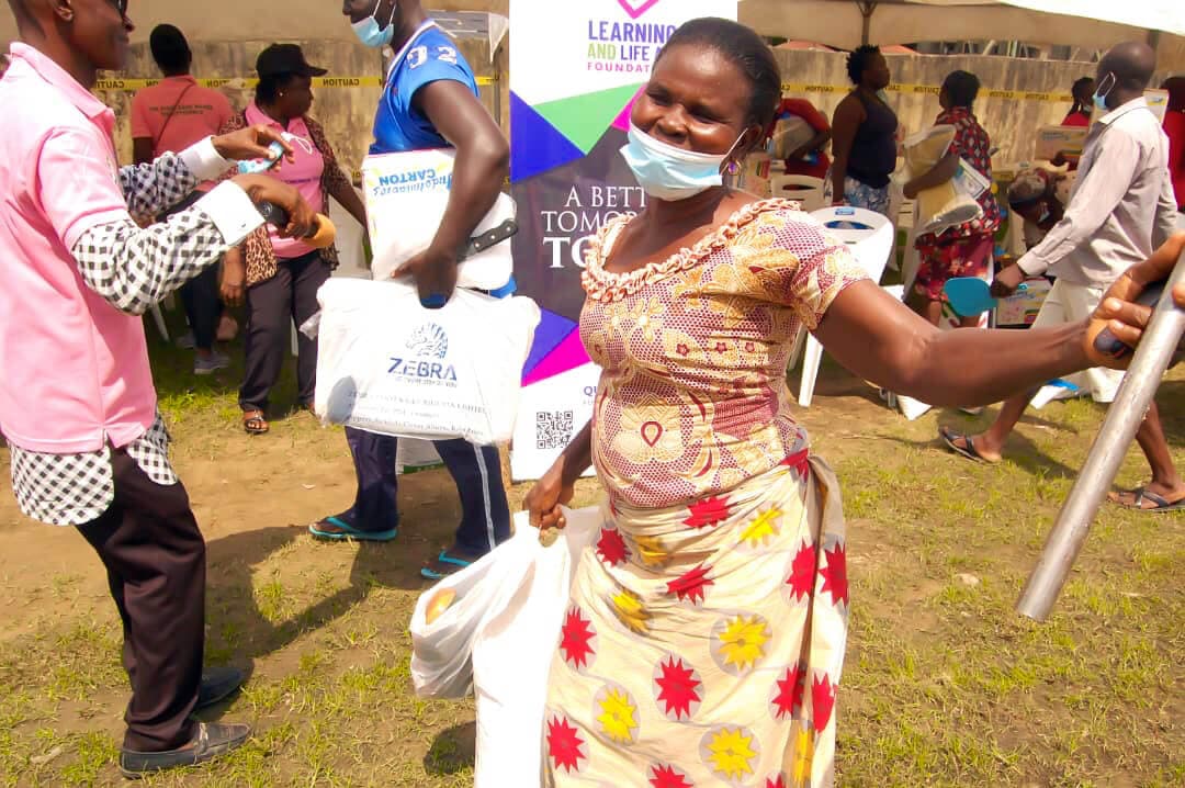 Documentary style photo of community members collaborating in a field